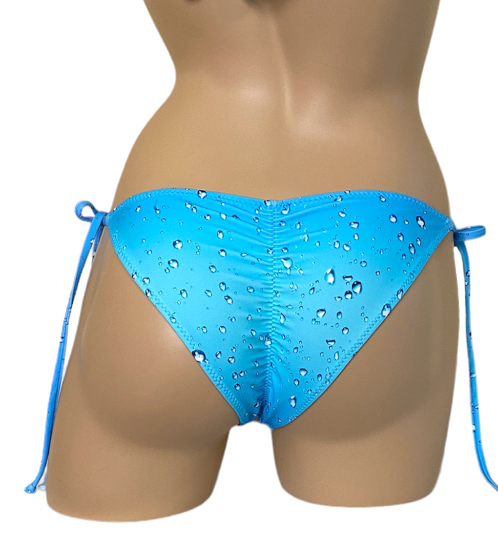 Low waist tie side ruched back bikini bottoms in blue rain print back view