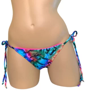 Low waist tie side reversible bikini bottoms in tie dye and pink front view