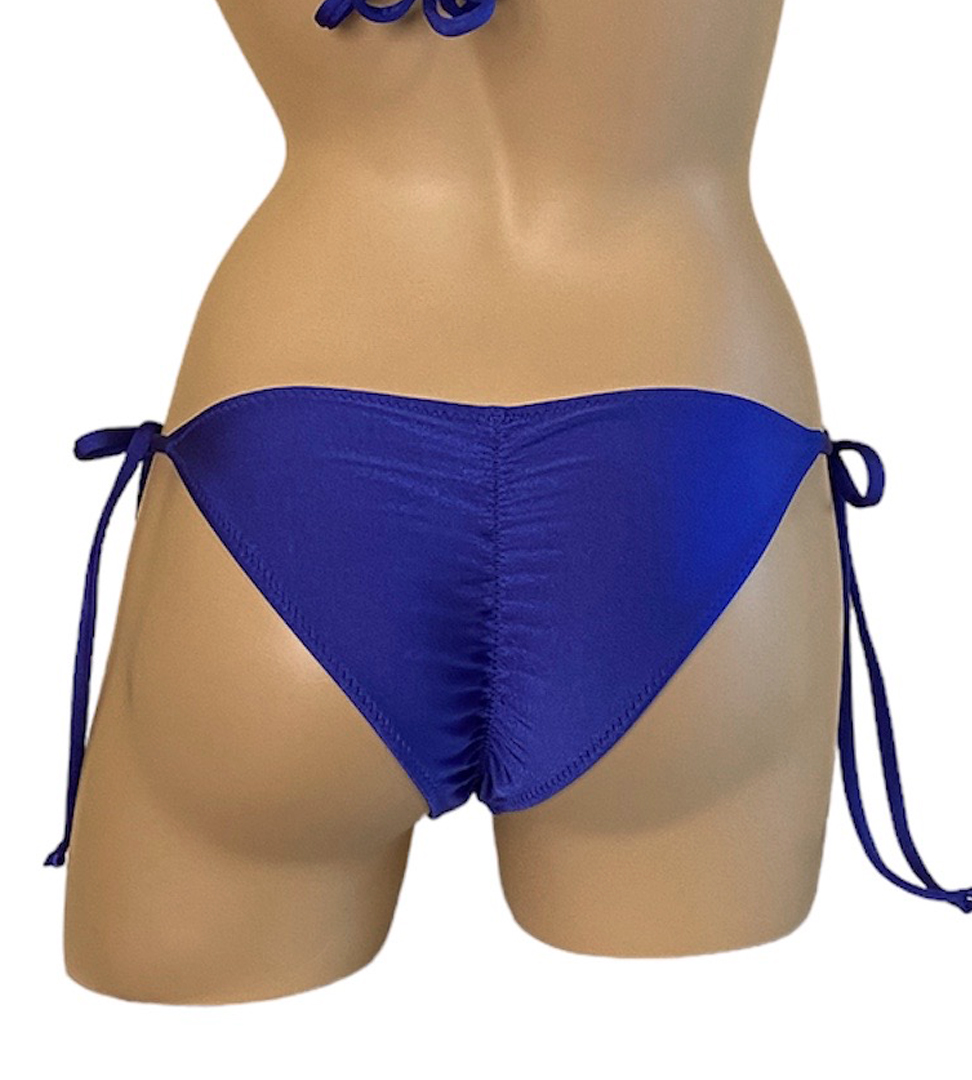 Low waist tie side ruched back bikini bottoms in royal blue back view