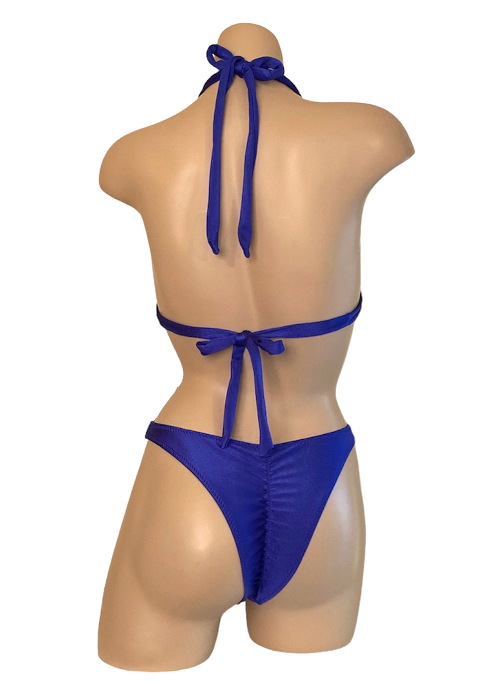 High cut ruched back cheeky bikini bottoms with double strap halter style bikini top in royal blue back view