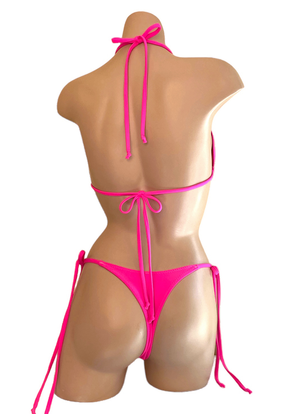 High cut, tie side, v-front, cheeky thong bikini bottoms and triangle top in hot pink back view