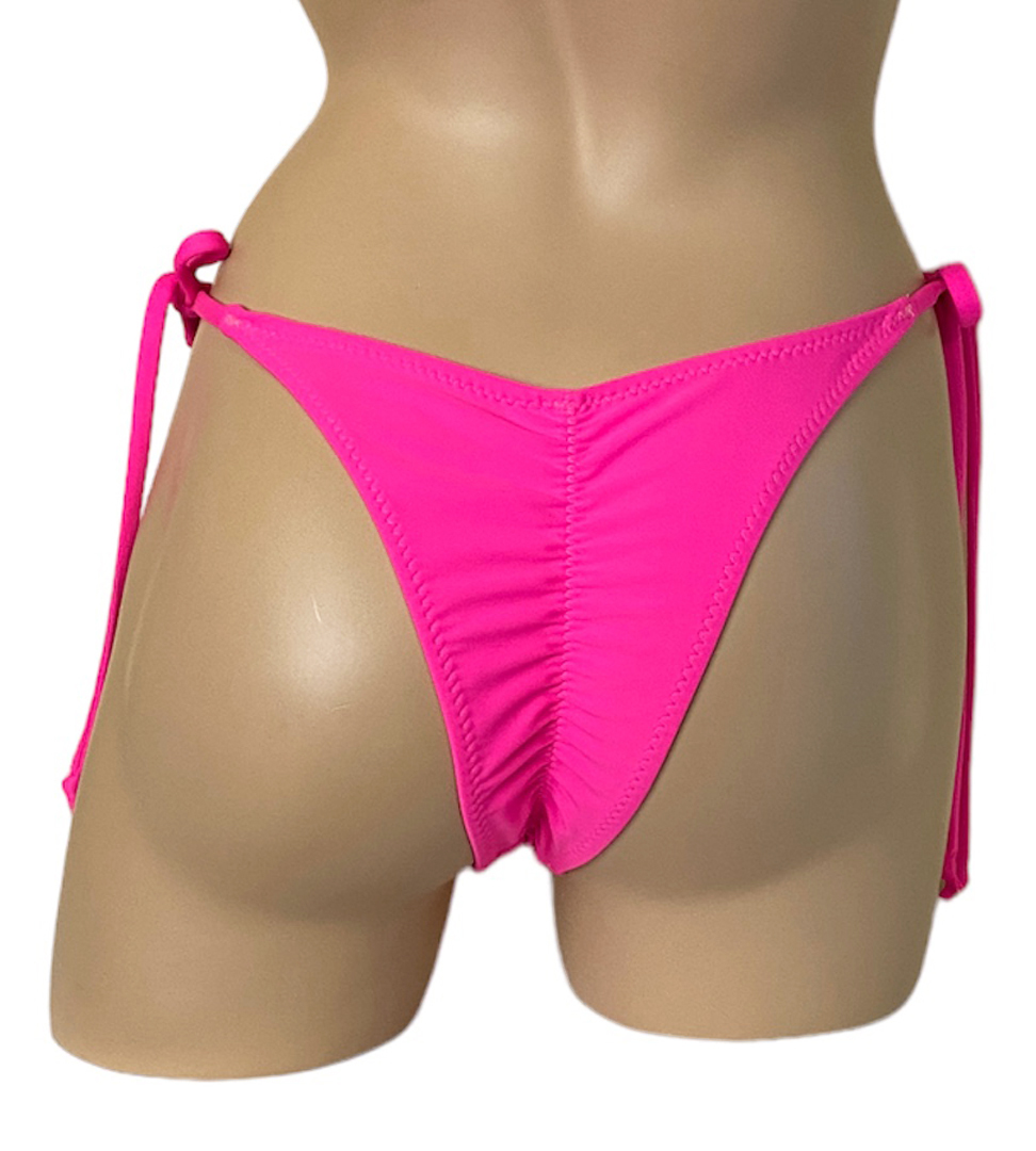 High cut tie side ruched back bikini bottoms in hot pink back view
