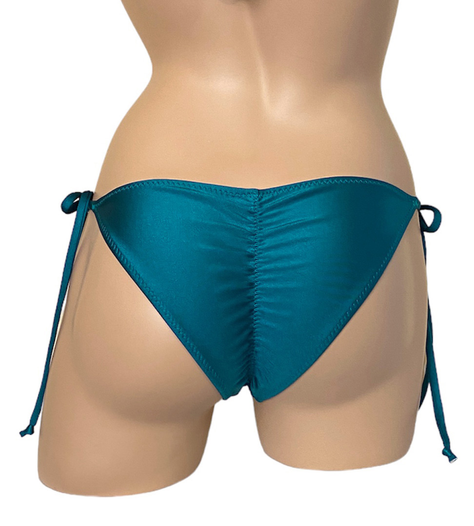 Low waist, tie side, ruched back bikini bottoms in teal back view