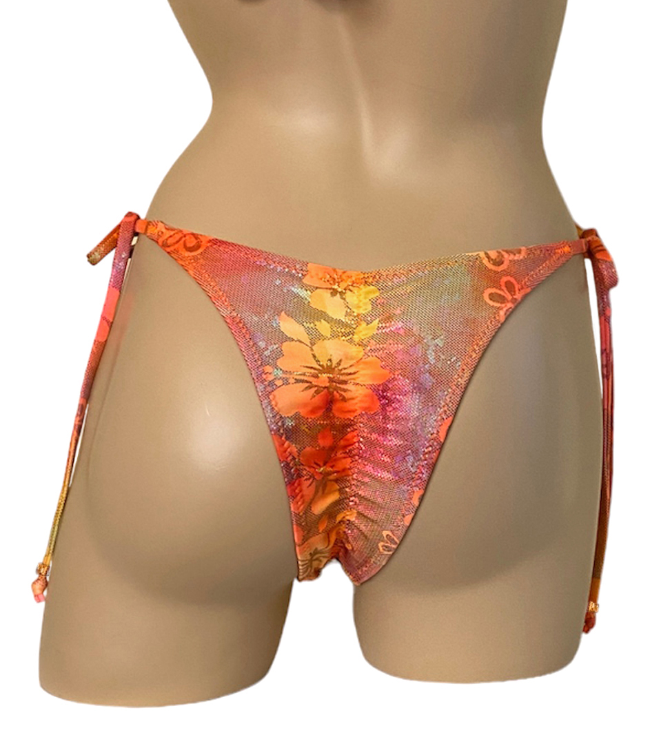High cut tie side ruched back bikini bottoms in orange crush floral print with bead detail at strap ends back view