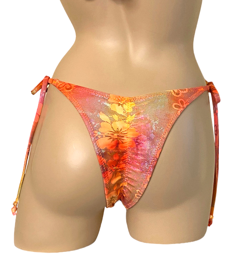 High cut tie side ruched back bikini bottoms in orange floral print with bead detail at strap ends back view