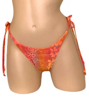 High cut tie side ruched back bikini bottoms in orange floral print with bead detail at strap ends front view