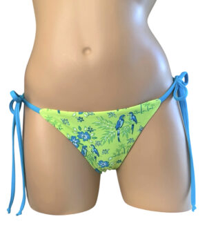 Reversible, low waist, brazilian, tie side bikini bottoms in tropical lime print front view