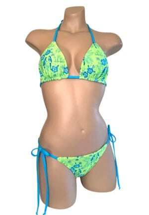Reversible low waist, brazilian cut, tie side bikini bottoms in tropical lime print with turquoise on the reverse front view