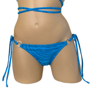 Low waist tie side ruched back bikini bottoms in blue zebra print with crystal side rings front view