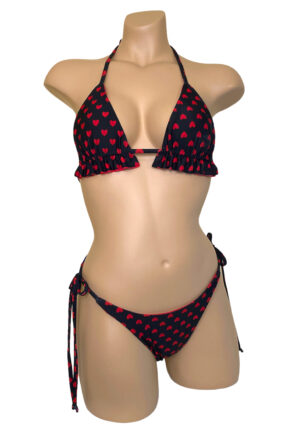 Reversible, high cut, ruched, tie side bikini bottoms and ruffled triangle top in red hearts print front view