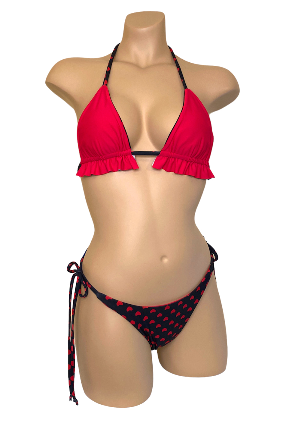 Reversible, high cut, tie side, ruched bikini bottoms and ruffled triangle top in red hearts print, red side front view