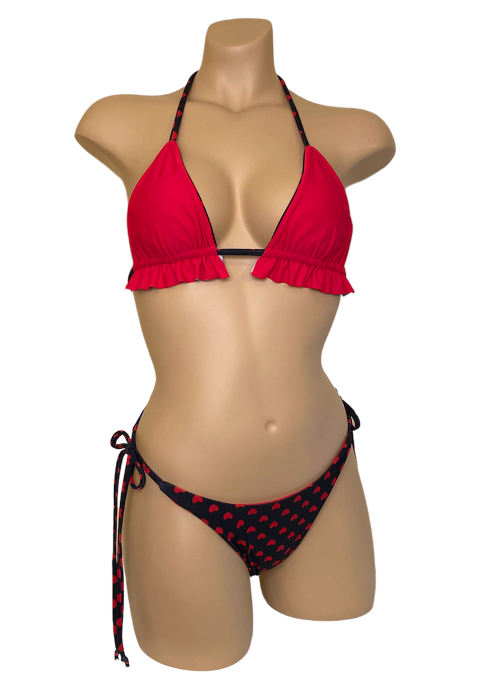 High hip tie side reversible bikni bottoms and ruffled triangle top in red hearts print, reverse side