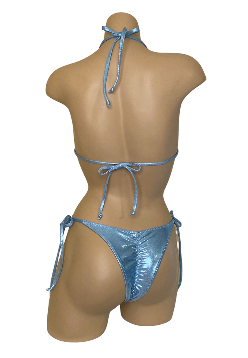 High cut ruched back tie side bikini bottoms with silver rings and triangle top with center ring in ice blue back view