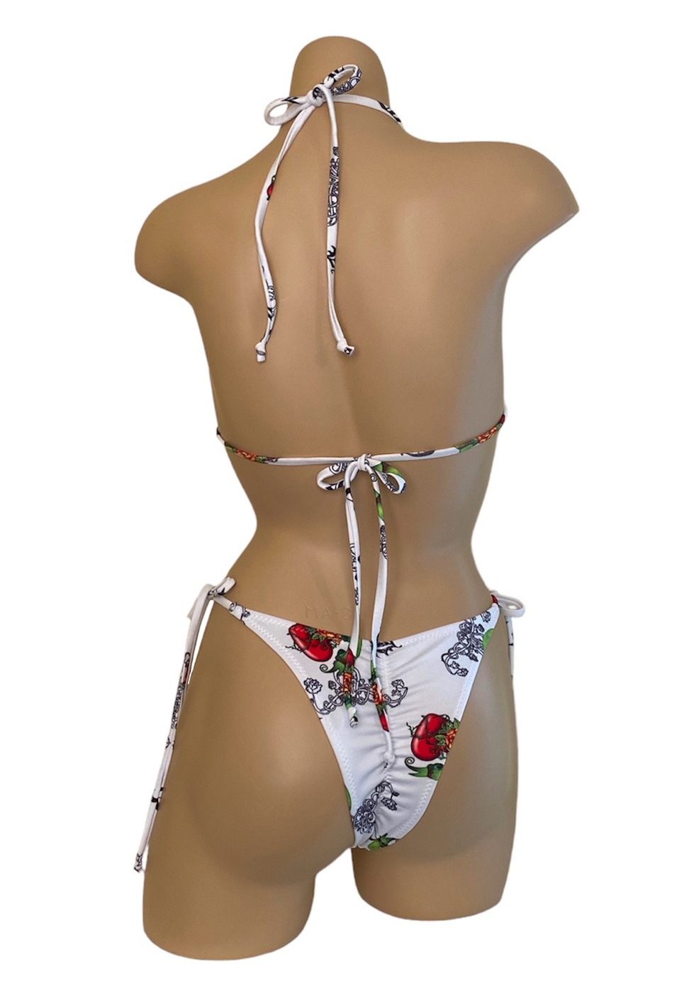 High hip, tie side, ruched back bikini bottoms with silver side rings and ringtop triangle bikini top with silver rings in loveheart print back view