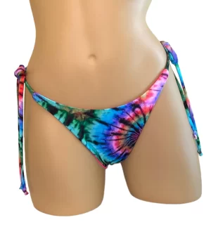 Reversible, high cut, tie side, ruched back bikini bottoms in tie dye with hot pink on the reverse front view