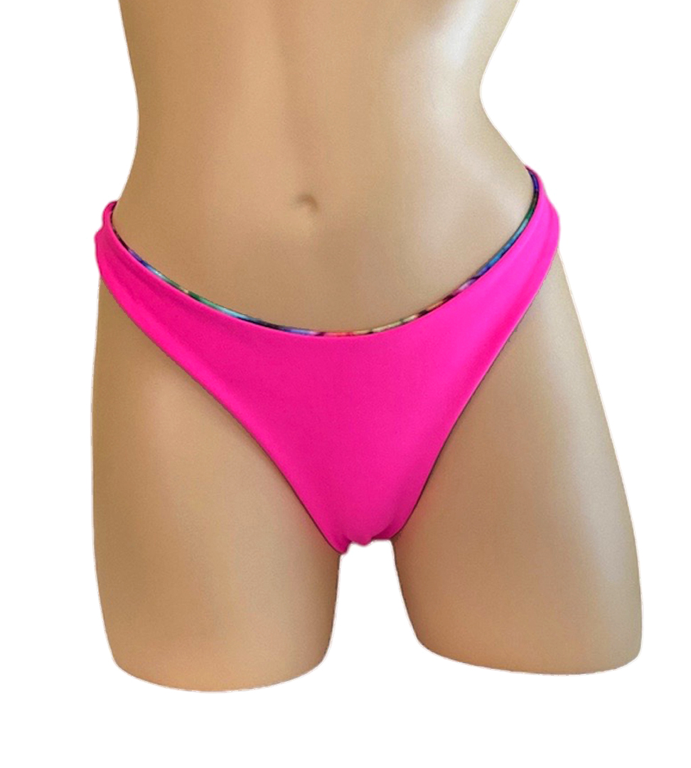Reversible high cut bikini bottoms in tie dye with hot pink on the reverse pink side front view