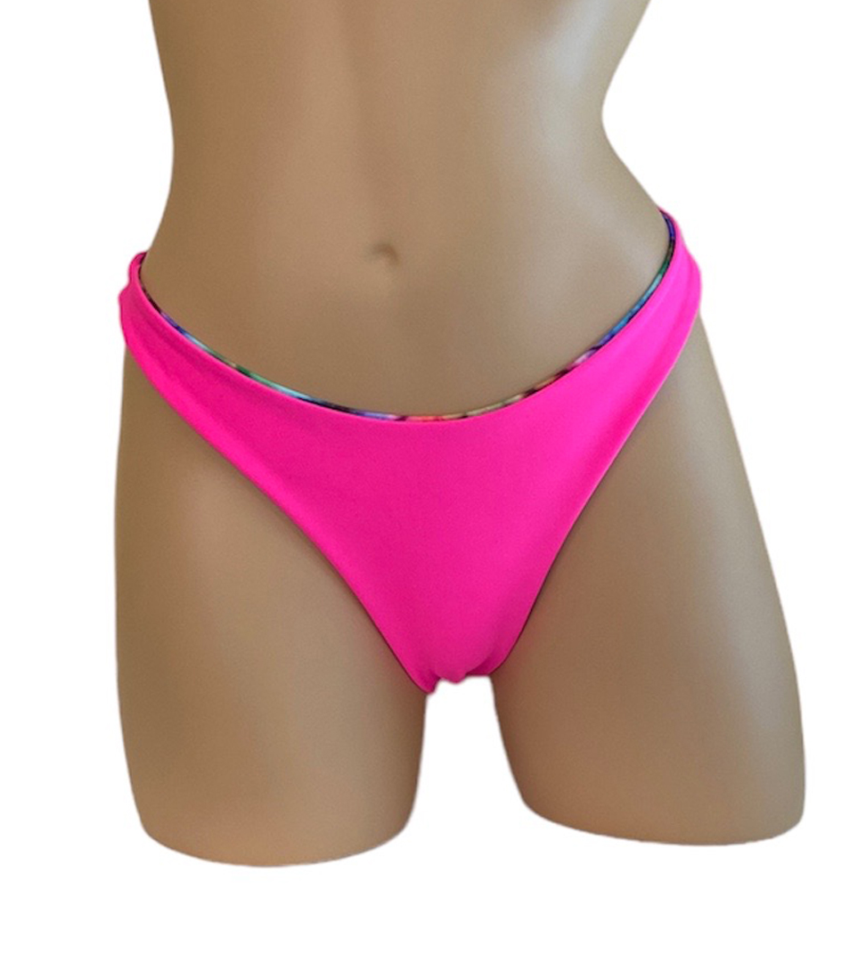 Reversible high cut bikini bottoms in tie dye with hot pink on the reverse pink side front