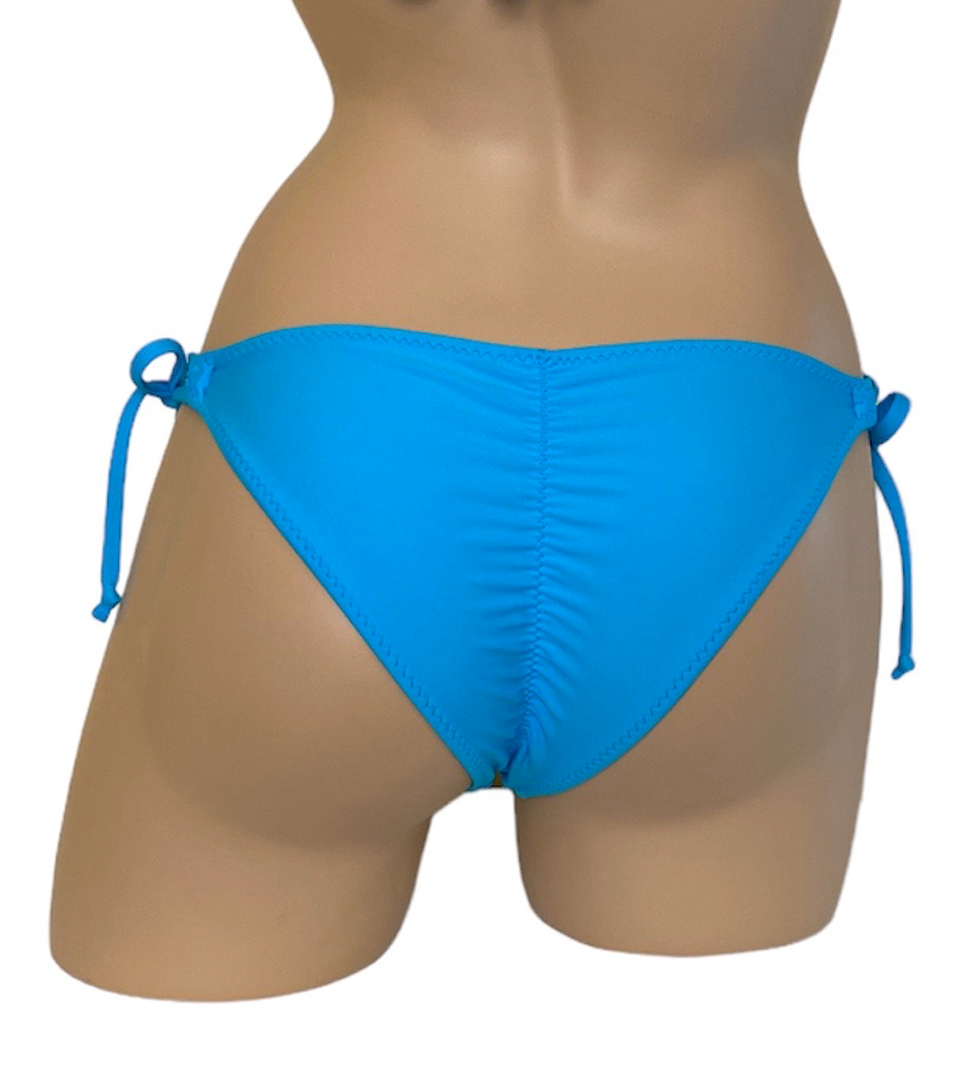 Low waist bikini bottoms with looped side ties and ruched back in turquoise back view