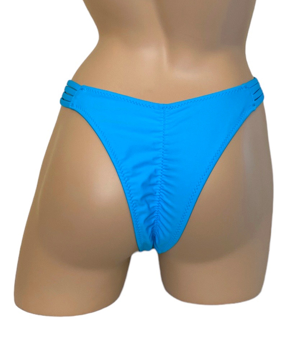 High cut strappy sides ruched back bikini bottoms in turquoise back view