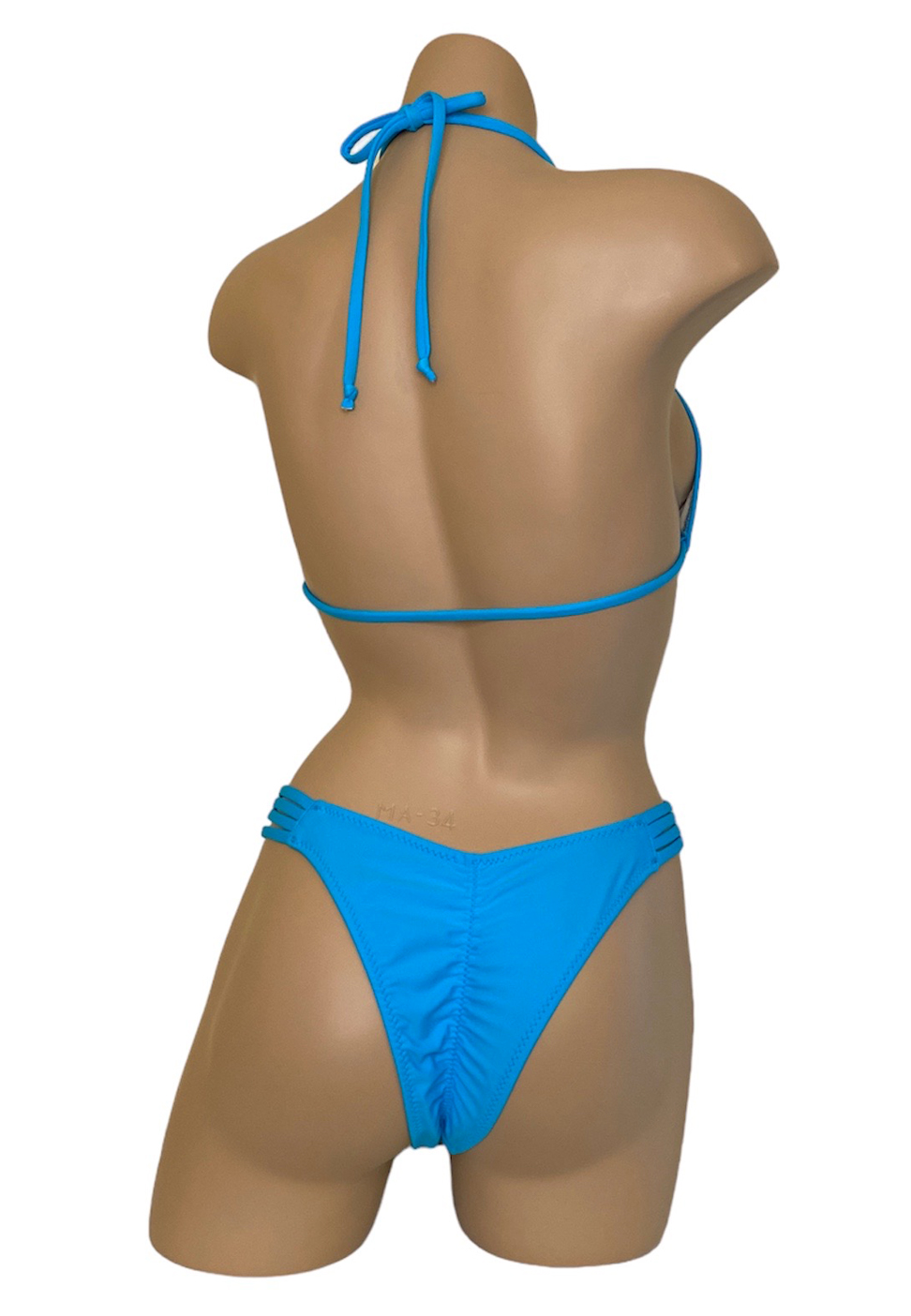 High cut strappy sides ruched back bikini bottoms with triangle bikini top in turquoise back view