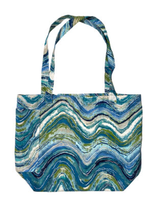large canvas tote beach bag in colorful wavy print in shades of blue