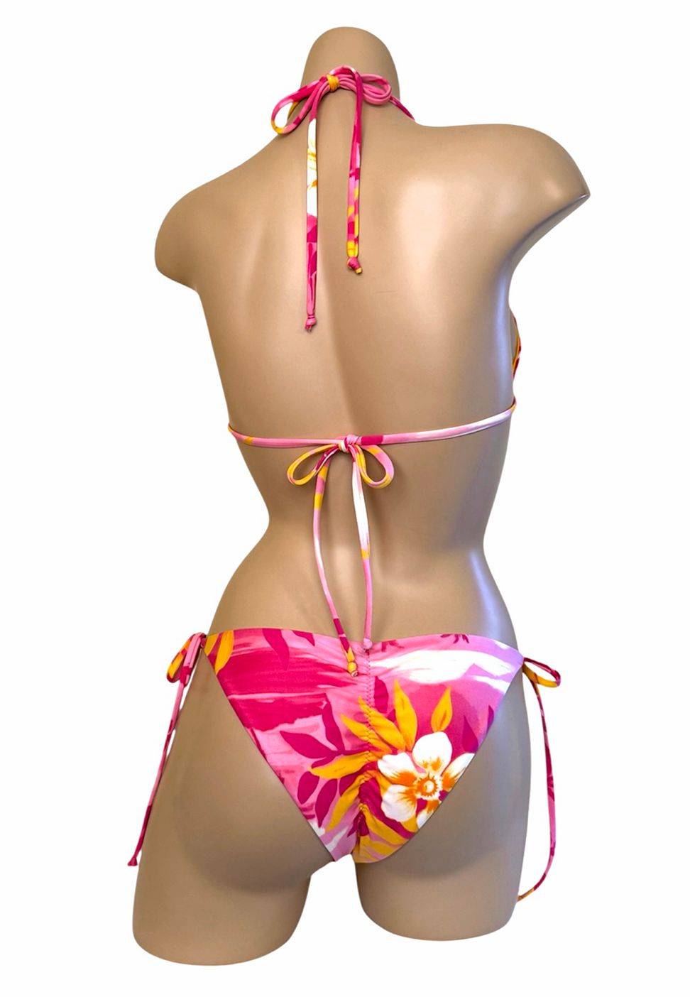 Reversible low waist tie side bikini bottoms and triangle top in tropical pink yellow back view