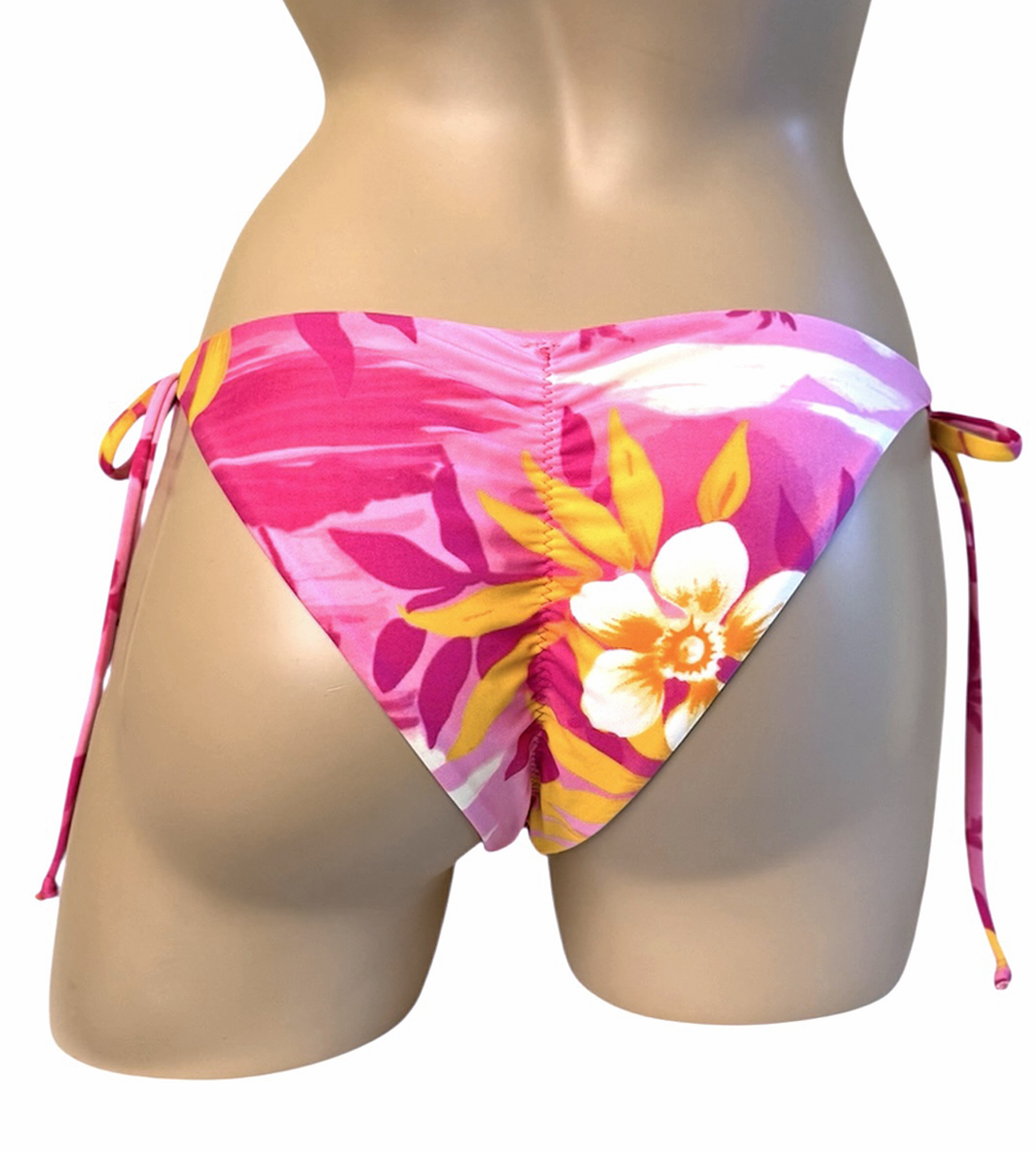 Reversible low waist, tie side, ruched back kiki bikini bottoms with yellow on the reverse back view