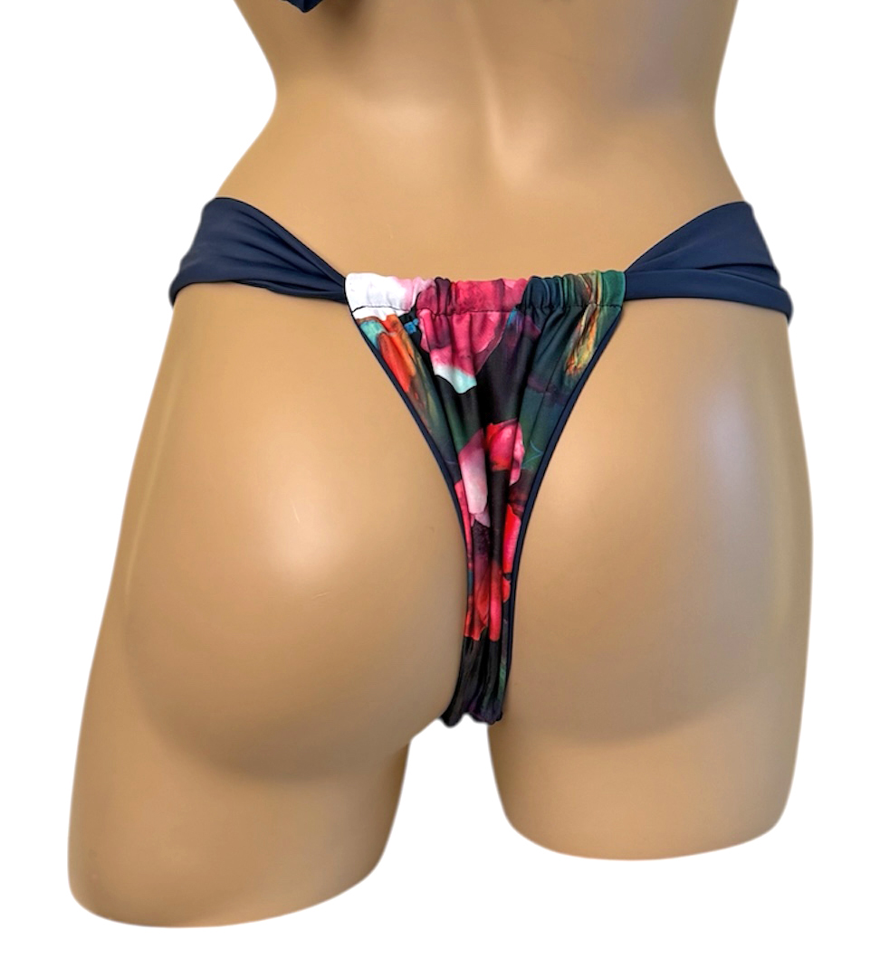 Reversible slide style bikini bottoms in waterlily print with indigo on the reverse back view
