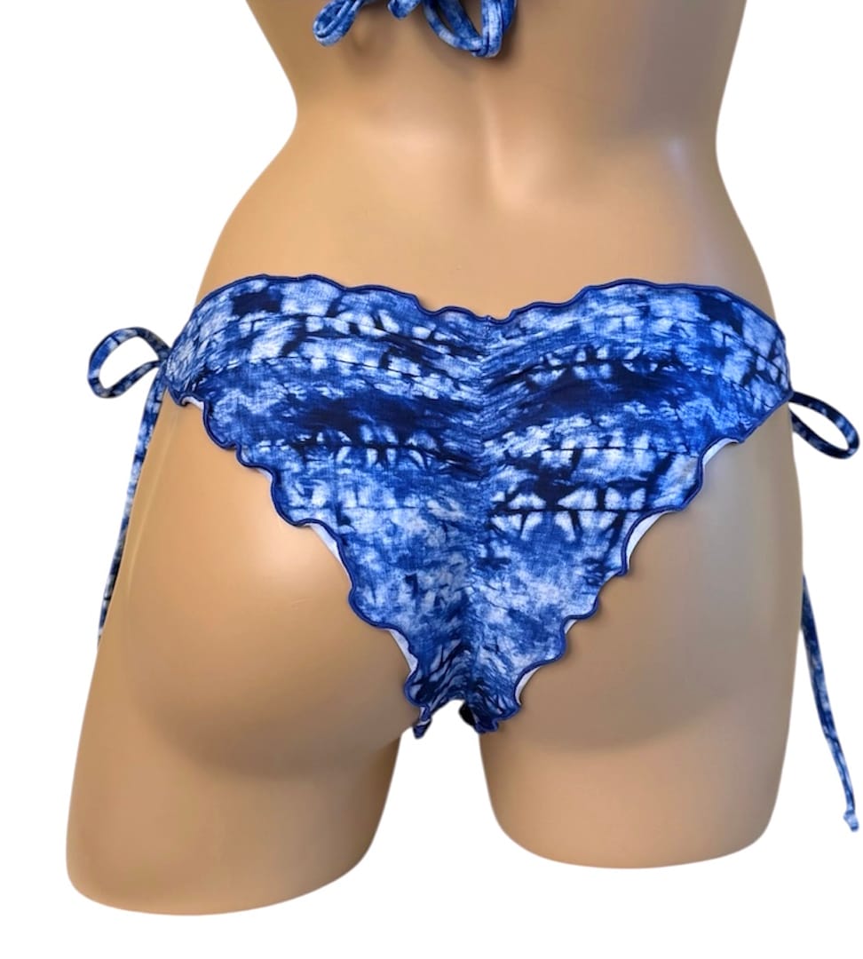 Low waist, ruffled, cheeky bikini bottoms and ruffled triangle top in tropical sunset floral print back view