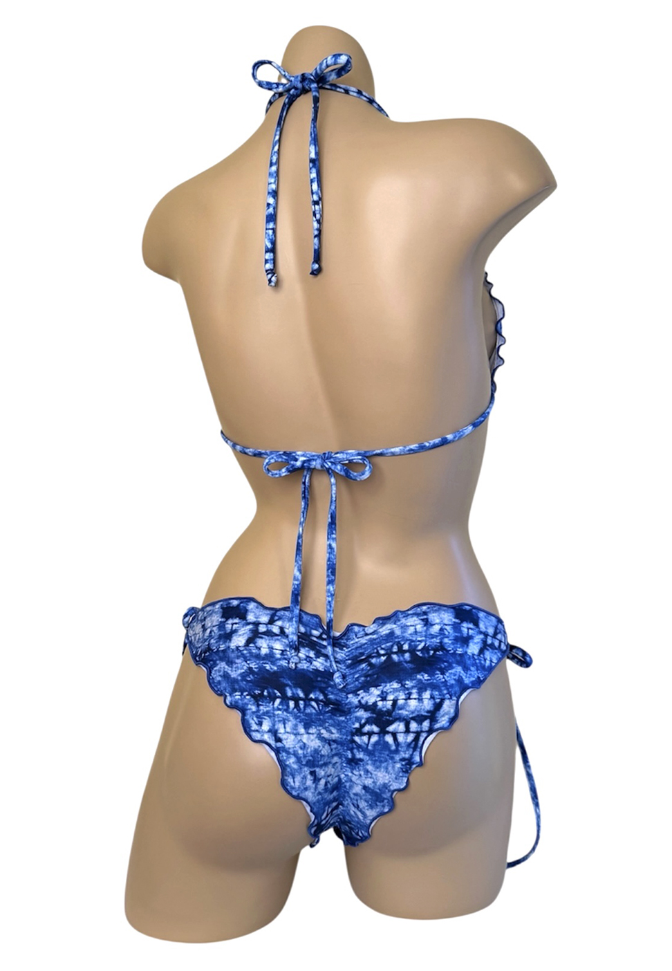 Low waist, ruffle edge, tie side bikini bottoms and ruffle edge triangle top in blue tide print back view