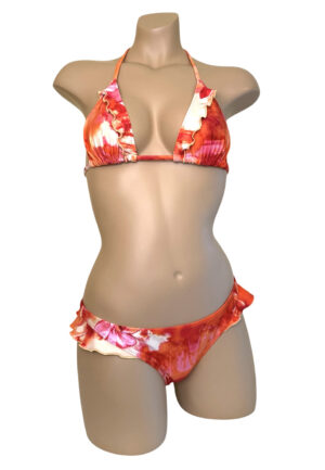 Low waist, cheeky, ruffled bikini bottoms and matching ruffled triangle top in tropical floral sunset print front view