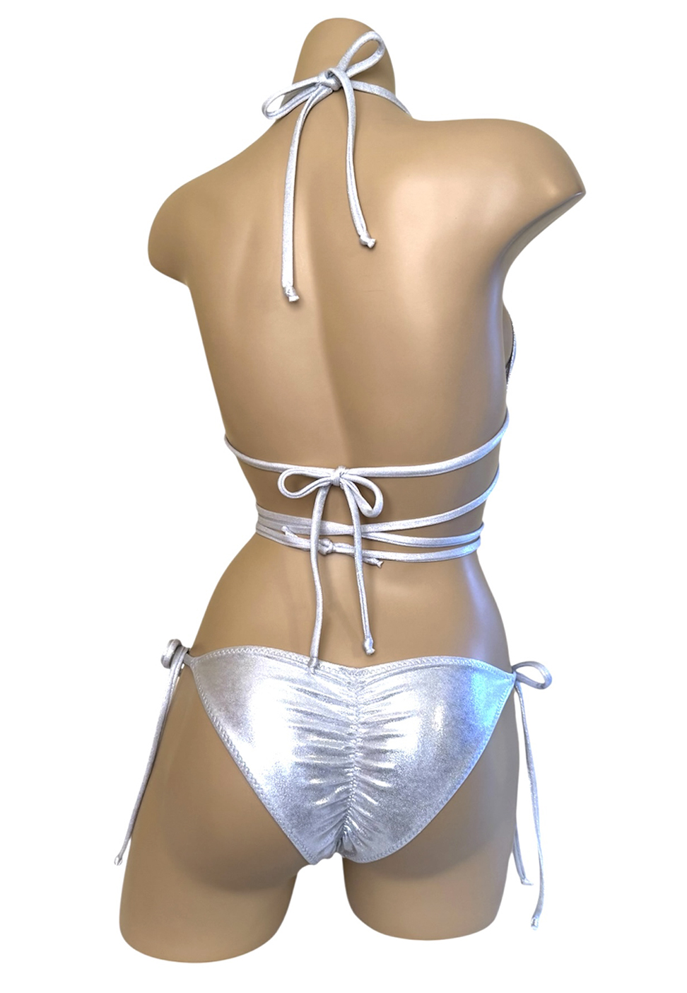metallic silver low waist, tie side, ruched back bikini bottoms and matching triangle bikini top with extra chest strap and silver crystal ring details back view