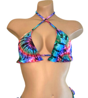 Tie dye reversible ruffled bikini top with hot pink on the reverse front view